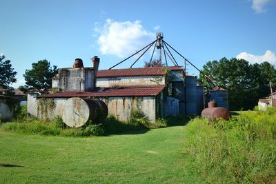 House on field against sky