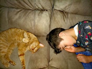 High angle view of baby sleeping on bed at home