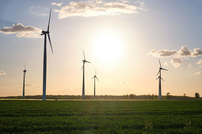 Landscape with modern wind turbines just before sunset seen in germany