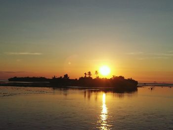 Scenic view of sea at sunset