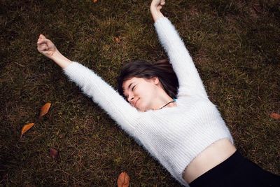 Woman lying on grass