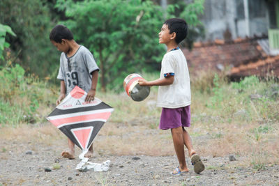 Side view of two children playing