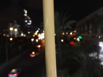 Defocused image of illuminated street lights at night