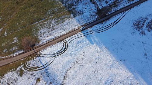 High angle view of swimming pool by lake during winter