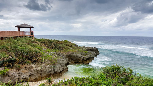 Scenic view of sea against cloudy sky