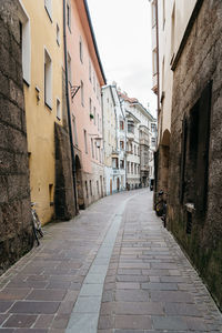 Street amidst residential buildings against sky