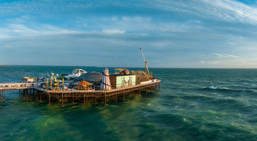 Aerial view of brighton palace pier, with the seafront behind.