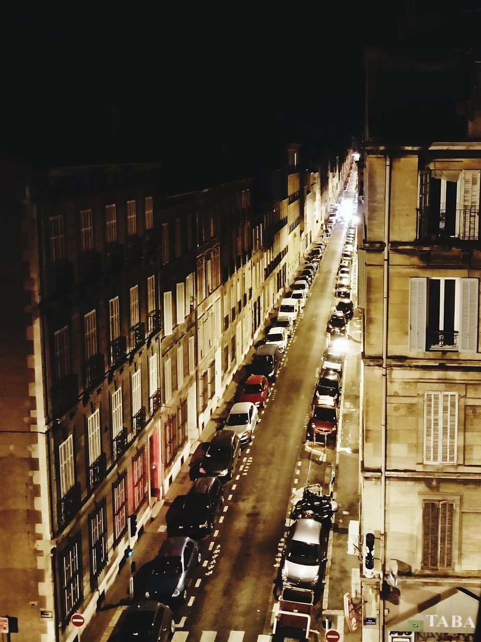 HIGH ANGLE VIEW OF CARS ON ROAD AT NIGHT