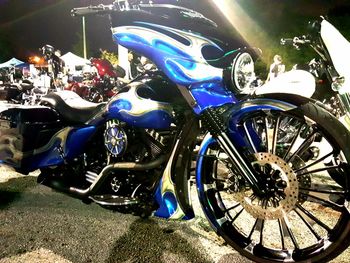 Close-up of illuminated motorcycle at night