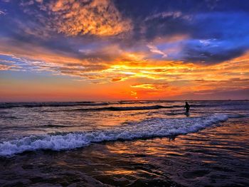 Scenic view of sea against sky during sunset