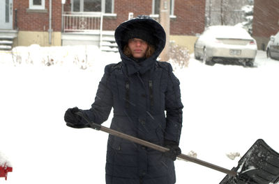 Woman standing in snow