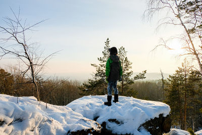 А severe hiker walking along the mountain path route. the urals landsc