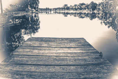 Pier over lake against sky