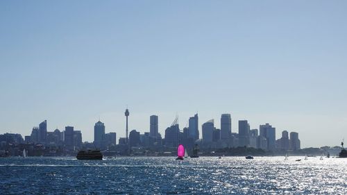 Rear view of woman with city in background