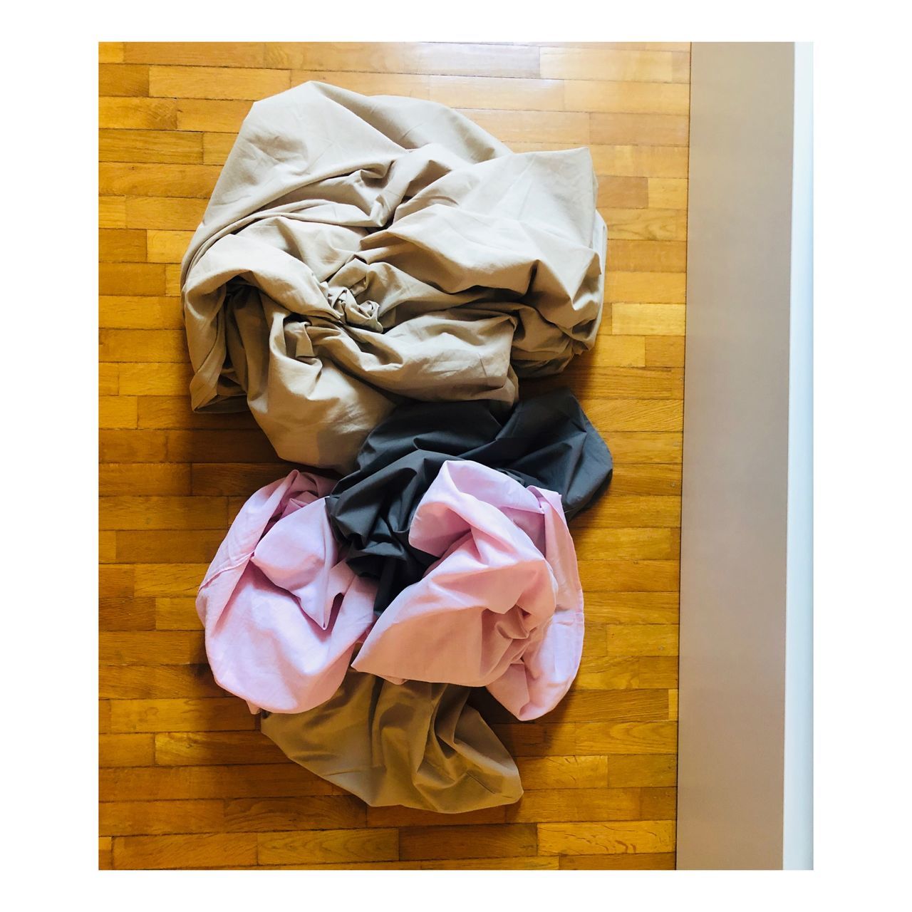 indoors, transfer print, no people, high angle view, auto post production filter, directly above, still life, clothing, wood - material, wood, hardwood floor, table, messy, furniture, flooring, bag, crumpled, close-up, container, medium group of objects
