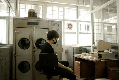 Man sitting in operation lab room
