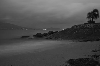 Scenic view of sea against sky at dusk