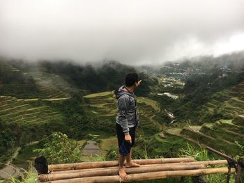 Full length of man standing on bamboos