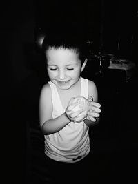 Portrait of cute boy drinking glass