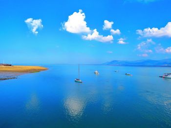 Scenic view of sea against blue sky