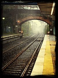 Railroad tracks on railroad station platform