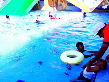 High angle view of people swimming in pool