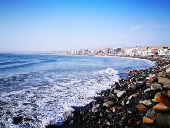 Scenic view of sea against clear blue sky