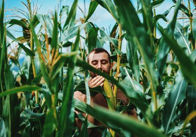 Portrait of man standing in field