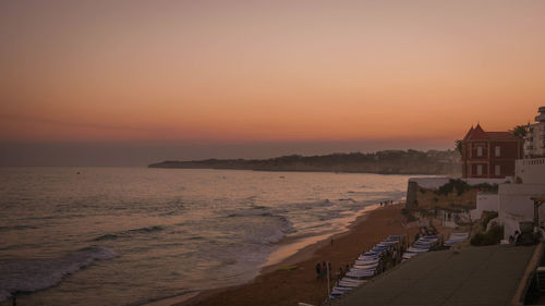 Scenic view of beach at sunset