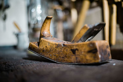 Close-up of rusty metal on table