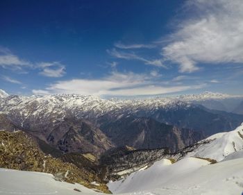 Scenic view of snowcapped mountains against sky