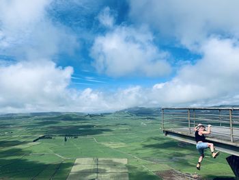 Man on landscape against sky