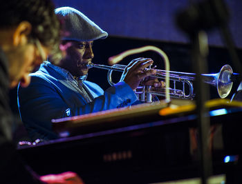 Man playing music concert at night