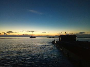 Scenic view of sea against sky at sunset