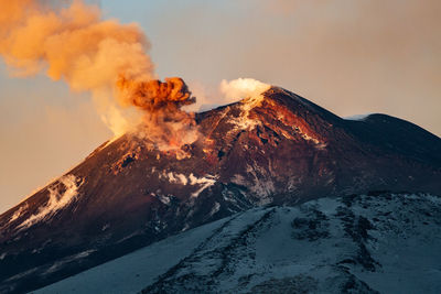 Panoramic view of volcanic mountain against sky during winter