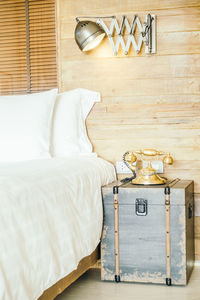 Telephone on side table in bedroom