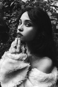 Close-up portrait of young woman looking away