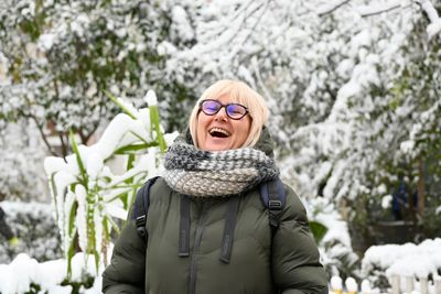 Portrait of smiling woman in snow