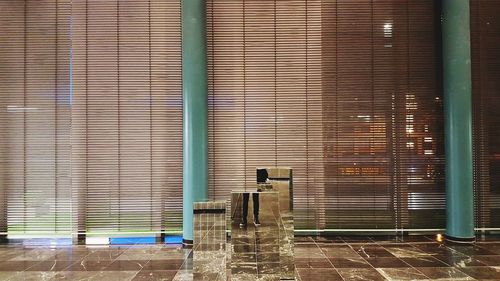 Tiled floor against blinds