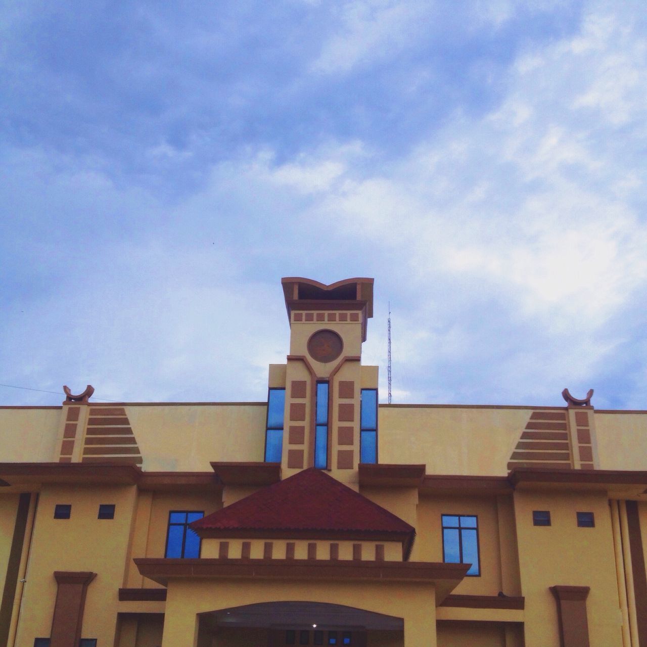 architecture, building exterior, built structure, low angle view, sky, place of worship, church, religion, cloud - sky, high section, spirituality, cloud, window, blue, outdoors, building, day, no people