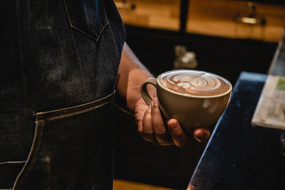 Coffee cup on table at cafe