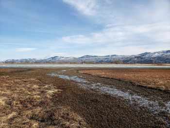 Scenic view of land against sky during winter