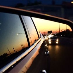 Close-up of car on road against sky