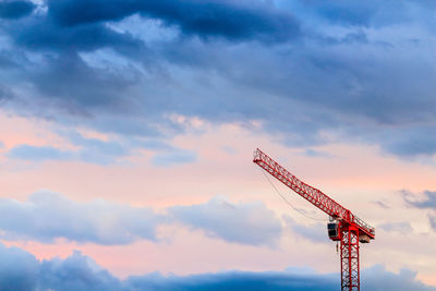 Low angle view of communications tower against sky