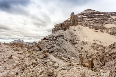 Low angle view of rock formations against sky