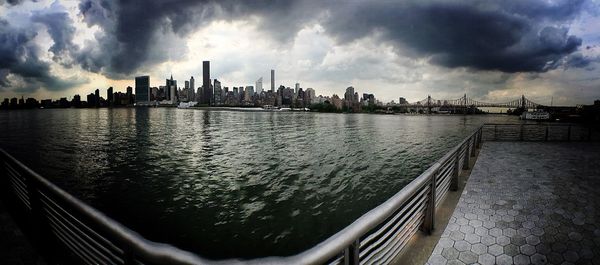 Cityscape against cloudy sky