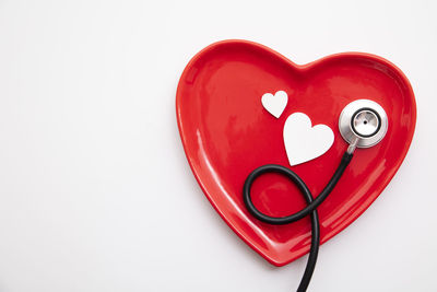 High angle view of heart shape on white background