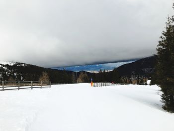 Scenic view of snow covered mountains against sky