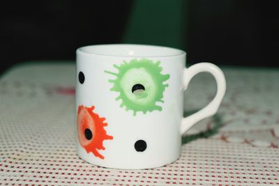 Close-up of coffee cup on table