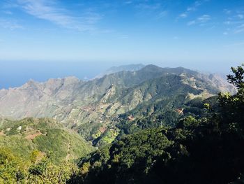 Scenic view of landscape against blue sky